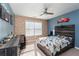 bedroom with dinosaur bedding, brick accent wall, and ample closet space at 1170 Rose Terrace Cir, Loganville, GA 30052