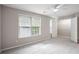 Bedroom with plush carpet, ceiling fan, and a walk-in closet at 3742 Berkeley Xing, Duluth, GA 30096