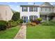 Charming townhome with well-manicured lawn and colorful landscaping at 3742 Berkeley Xing, Duluth, GA 30096