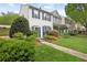 Inviting townhome with lush landscaping and blue shutters at 3742 Berkeley Xing, Duluth, GA 30096