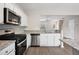 Updated kitchen with granite countertops and stainless steel appliances at 3742 Berkeley Xing, Duluth, GA 30096