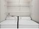 Laundry area with full sized washer and dryer and wire shelving at 3742 Berkeley Xing, Duluth, GA 30096