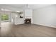 Open-concept living space featuring a cozy fireplace and modern flooring at 3742 Berkeley Xing, Duluth, GA 30096