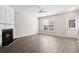 Bright living room with fireplace, wood floors, and ample natural light at 3742 Berkeley Xing, Duluth, GA 30096