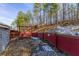 Landscaped backyard with wooden retaining wall and seating area at 3886 Cedar Trace Ln, Ellenwood, GA 30294