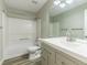 Clean bathroom, featuring a shower/tub combo, toilet and vanity with a white countertop at 3886 Cedar Trace Ln, Ellenwood, GA 30294