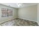 Spacious bedroom with wood-look flooring and large window, offering ample natural light at 3886 Cedar Trace Ln, Ellenwood, GA 30294