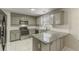 Modern kitchen with stainless steel appliances and island at 3886 Cedar Trace Ln, Ellenwood, GA 30294