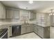 Kitchen with granite countertops and gray cabinets at 3886 Cedar Trace Ln, Ellenwood, GA 30294