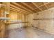 Unfinished storage shed with wooden walls and shelving at 3886 Cedar Trace Ln, Ellenwood, GA 30294