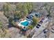 Heart-shaped community pool with surrounding parking and landscaping at 1647 Raleigh Se Cir, Marietta, GA 30067