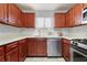 Modern kitchen featuring wood cabinets and stainless steel appliances at 1647 Raleigh Se Cir, Marietta, GA 30067