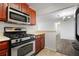 Bright kitchen featuring stainless steel appliances and wood cabinets at 1647 Raleigh Se Cir, Marietta, GA 30067