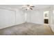 Spacious bedroom with double doors, carpet flooring and an ensuite bathroom at 19 Roving Hills Cir, Cartersville, GA 30121