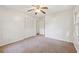 Bright bedroom with carpet, ceiling fan, and window at 19 Roving Hills Cir, Cartersville, GA 30121