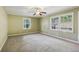 Spacious bedroom with wall-to-wall carpeting and large windows at 19 Roving Hills Cir, Cartersville, GA 30121