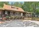 Ranch style home with wood siding, covered porch, and landscaped yard at 19 Roving Hills Cir, Cartersville, GA 30121