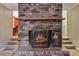 Brick fireplace with a classic design and a warm fire at 19 Roving Hills Cir, Cartersville, GA 30121