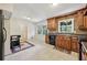 Kitchen with wood cabinets, granite countertops, and tile floors at 19 Roving Hills Cir, Cartersville, GA 30121