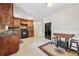Kitchen with wood cabinets, granite countertops, and tile floors at 19 Roving Hills Cir, Cartersville, GA 30121