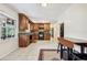 Kitchen with wood cabinets, granite countertops, and tile floors at 19 Roving Hills Cir, Cartersville, GA 30121