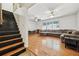 Open living room with hardwood floors and sectional sofa at 19 Roving Hills Cir, Cartersville, GA 30121