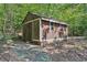 Wooden storage shed in backyard at 19 Roving Hills Cir, Cartersville, GA 30121