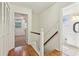 Upstairs hallway with hardwood floors, linen closet and bathroom at 19 Roving Hills Cir, Cartersville, GA 30121