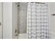 Bathroom with a shower and striped shower curtain at 1018 Westmont Sw Rd, Atlanta, GA 30311