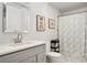 Clean bathroom with a shower/tub combo and gray vanity at 1018 Westmont Sw Rd, Atlanta, GA 30311