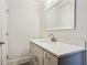 Bathroom with gray vanity and a large mirror at 1018 Westmont Sw Rd, Atlanta, GA 30311