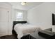 Cozy bedroom with a double bed and dark wood floors at 1018 Westmont Sw Rd, Atlanta, GA 30311