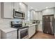 Renovated kitchen with stainless steel appliances and white quartz countertops at 1018 Westmont Sw Rd, Atlanta, GA 30311