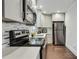 Modern kitchen featuring stainless steel appliances and quartz countertops at 1018 Westmont Sw Rd, Atlanta, GA 30311