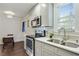 Modern kitchen with stainless steel appliances and gray cabinets at 1018 Westmont Sw Rd, Atlanta, GA 30311