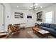 Bright living room featuring hardwood floors, a comfy sofa, and modern decor at 1018 Westmont Sw Rd, Atlanta, GA 30311