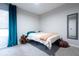 Cozy bedroom featuring a full-size bed and teal curtains at 592 Waynes Ct, Atlanta, GA 30354