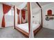 Main bedroom with canopy bed, hammock chair, and orange curtains at 592 Waynes Ct, Atlanta, GA 30354