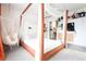 Main bedroom with canopy bed, hammock chair, and orange curtains at 592 Waynes Ct, Atlanta, GA 30354