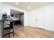 Open dining room with kitchen access and wood-look floors at 592 Waynes Ct, Atlanta, GA 30354