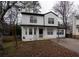 Two-story house with white siding, driveway, and mature trees at 592 Waynes Ct, Atlanta, GA 30354