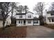 Two-story house with white siding, driveway, and mature trees at 592 Waynes Ct, Atlanta, GA 30354