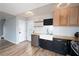 Modern kitchen with white subway tile, butcher block counters, and stainless steel appliances at 592 Waynes Ct, Atlanta, GA 30354