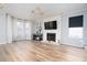 Living room features hardwood floors, fireplace, and large windows at 592 Waynes Ct, Atlanta, GA 30354