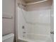 Bathroom with tub, shower, and white fixtures at 157 Parkview Place Dr, Mcdonough, GA 30253