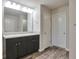 Bathroom with double vanity and dark brown cabinets at 157 Parkview Place Dr, Mcdonough, GA 30253