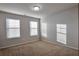 Spacious bedroom with neutral walls and carpet flooring at 157 Parkview Place Dr, Mcdonough, GA 30253