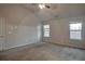 Large bedroom featuring carpeted floors and ample natural light at 157 Parkview Place Dr, Mcdonough, GA 30253