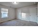 Bedroom with closet, window, and neutral decor at 157 Parkview Place Dr, Mcdonough, GA 30253