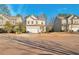 Two story house on a tree lined street with other houses visible at 157 Parkview Place Dr, Mcdonough, GA 30253